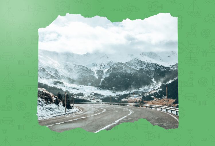 Snow-covered mountain road winding through a scenic winter landscape near Delhi